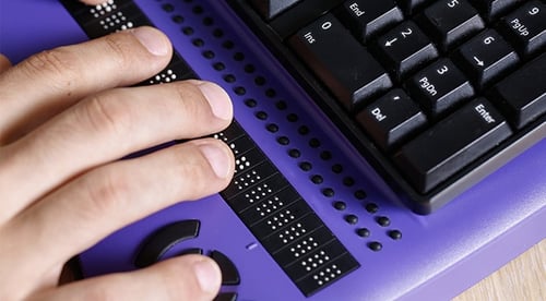 A person using their native assistive technology