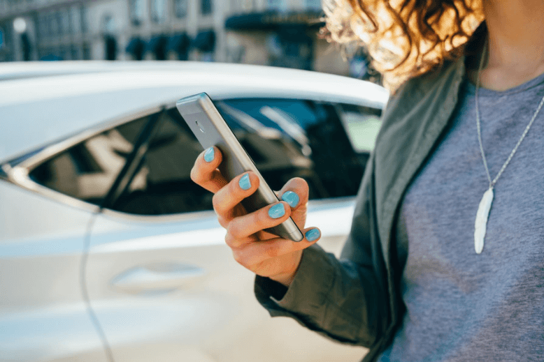 A woman typing on her mobile phone.