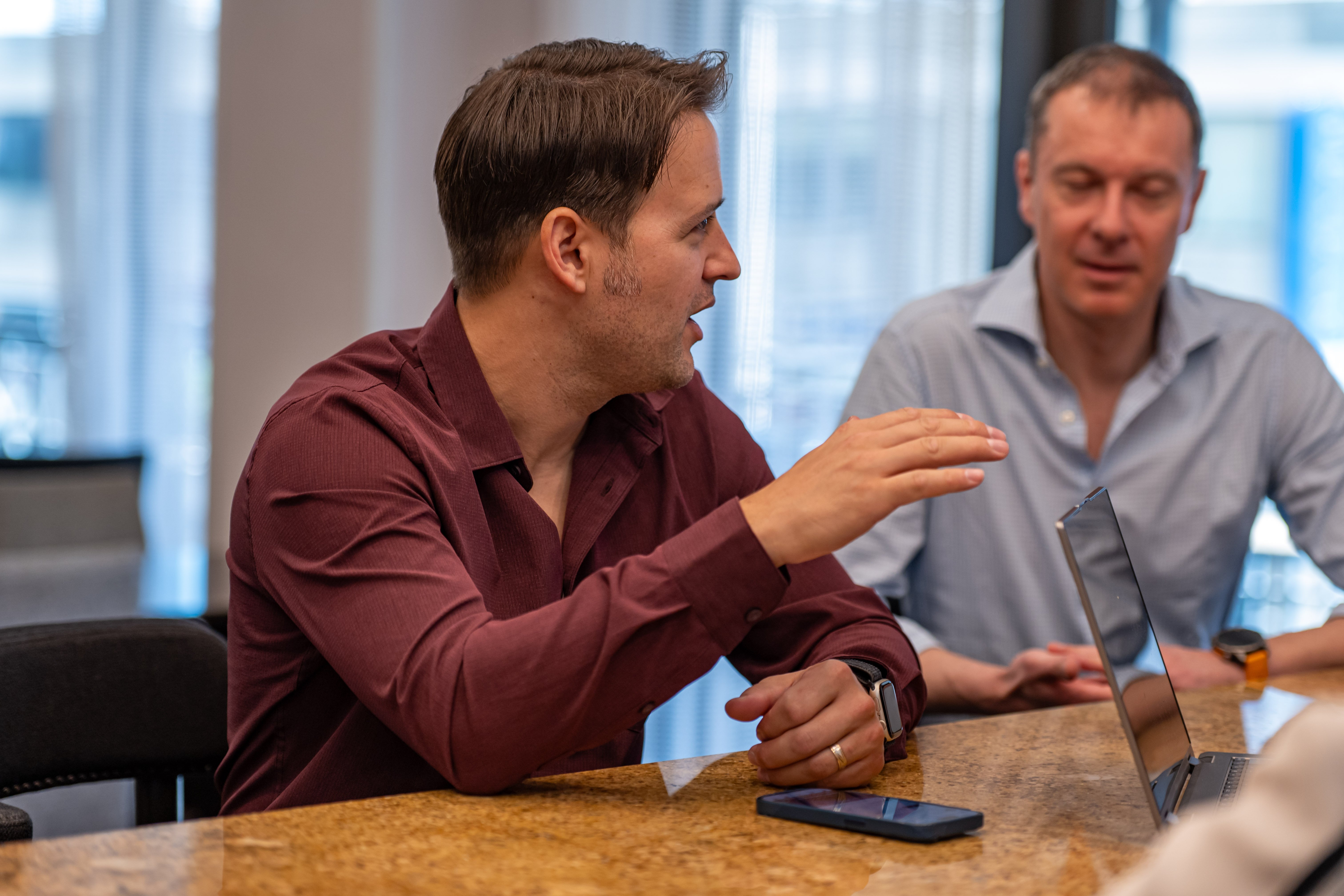 Colleagues collaborating on an accessible mobile app 