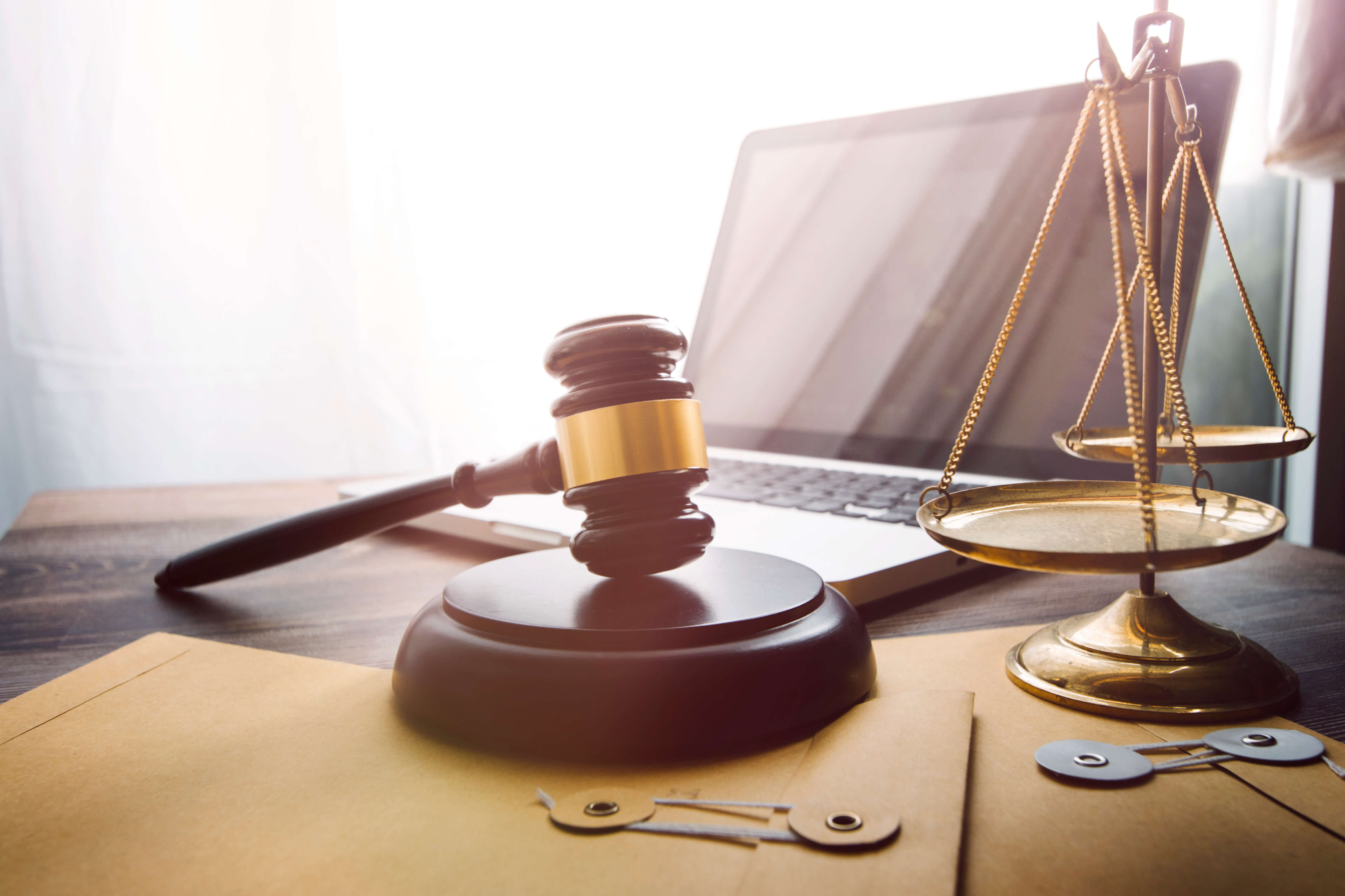 gavel, laptop, and scales of justice to signify web accessibility lawsuits 